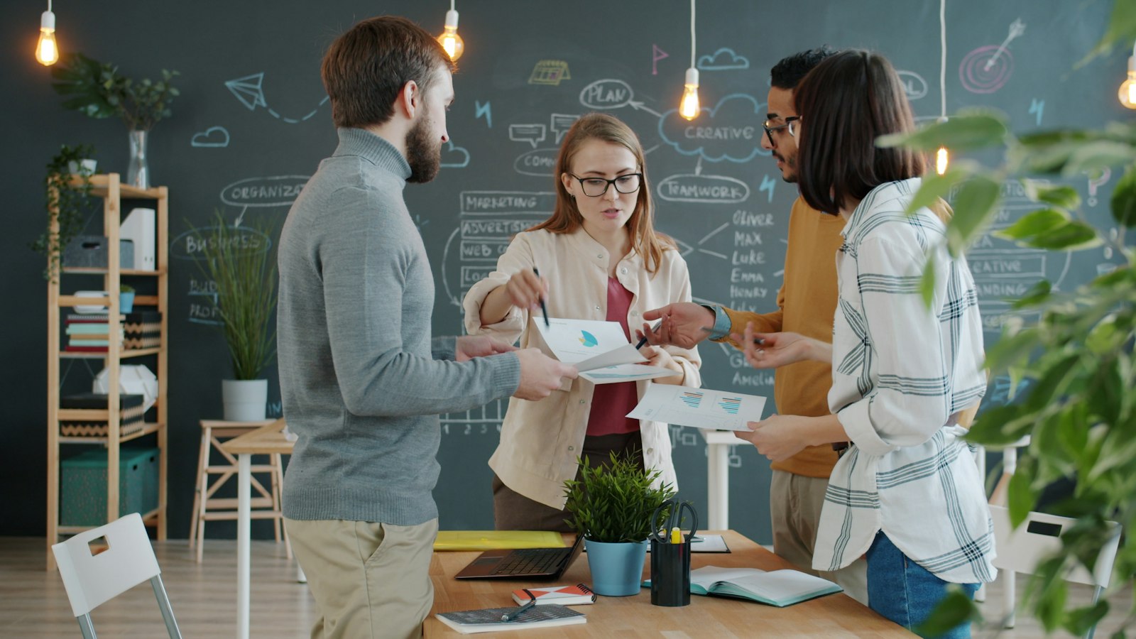 Business colleagues reviewing documents together at an office desk